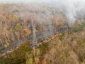 Bushfire is burning near power transmission tower line Royalty Free Stock Photo
