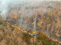 Bushfire is burning near power transmission tower line Royalty Free Stock Photo