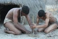 Bushmen lighting fire Royalty Free Stock Photo