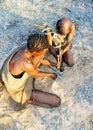 Bushmen making fire Royalty Free Stock Photo