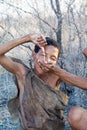 Bushmen woman is drinking the water