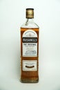 Bushmills whiskey bottle on white background close-up