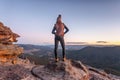 Bushwalker on summit of mountain with valley views Royalty Free Stock Photo