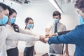 Busines people wearing face mask and  Business meeting in modern office while pandemic of virus Royalty Free Stock Photo