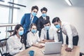 Busines people wearing face mask and  Business meeting in modern office while pandemic of virus Royalty Free Stock Photo