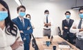 Busines people wearing face mask with presentation of business plan . Business meeting in modern office while pandemic of virus Royalty Free Stock Photo