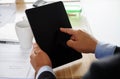 Businesman finger pointing to blank tablet