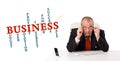 Businesman sitting at desk with business word cloud Royalty Free Stock Photo
