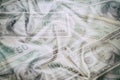 Business abstract background - banknotes of dollars close-up, scattered on wrinkled fabric