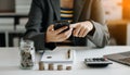 Business accountant working on desk using mobile phone and calculator to calculate budget concept finance and accounting in Royalty Free Stock Photo