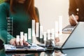 Business accountant working on desk using mobile phone and calculator to calculate budget concept finance and accounting in Royalty Free Stock Photo