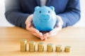 Business accounting man hands working stacking coin the calculator, calculating, financial investment planning and saving concept Royalty Free Stock Photo