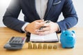 Business accounting man hands working stacking coin the calculat Royalty Free Stock Photo