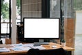 Business accounting workspace with computer blank white screen at office Royalty Free Stock Photo