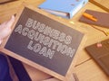 Business acquisition loan is shown on the business photo