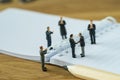 Business agreement concept with miniature people small figure bu Royalty Free Stock Photo