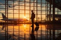 Business airport concept Silhouettes of a businessman with his suitcase, waiting for a plane