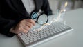 Business analysis concept with graphs and charts, focus on data interpretation, keyboard, and magnifying glass in modern Royalty Free Stock Photo