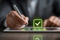 Business approval process showing signature on digital check mark for agreement Royalty Free Stock Photo