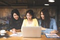 Business asia women partners discussing graph of financial in work space,casual outfit.