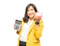 Business asian lady people in yellow suit holding calculator and piggy bank isolated on white background finance economy banking Royalty Free Stock Photo