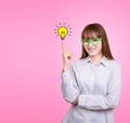 Business Asian woman with green glasses stand and have idea lamp Royalty Free Stock Photo
