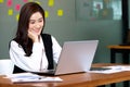 Business asian woman happy working job on laptop in office Royalty Free Stock Photo