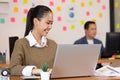 Business asian woman happy working job on laptop in office Royalty Free Stock Photo