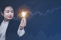 Business Asian woman Holding Illuminated Light Bulb with innovative and creativity are keys to success,innovation and inspiration, Royalty Free Stock Photo