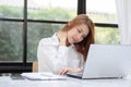 Business Asian woman working with laptop and have a neck and shoulder pain Royalty Free Stock Photo