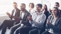 Business audience applauding to speaker at conference Royalty Free Stock Photo