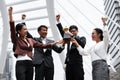 Business background of asian business people being cheerful for being winner in business competition contest with hand holding