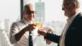 Business background of caucasian businessman having glass of champange on hands and toasting together