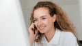 Business background of caucasian female customer service agent on telephone service to customers at helpdesk call center Royalty Free Stock Photo