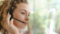 Business background of caucasian female customer service agent on telephone service to customers at helpdesk call center Royalty Free Stock Photo