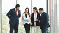 Business background of group of businesspeople standing together and having business discussion in office Royalty Free Stock Photo