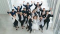 Business background of group of diverse business people, asian and caucasian, raise hands and fists up in concept of cheer up Royalty Free Stock Photo