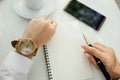 Business background hand of businessman wearing wooden watch wit Royalty Free Stock Photo