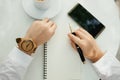 Business background hand of businessman wearing wooden watch wit Royalty Free Stock Photo