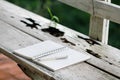 Stock photo :Open Notebook and white pen on old wooden backgrou Royalty Free Stock Photo