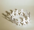 Business background.team paper men standing holding hands. Royalty Free Stock Photo