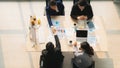 Business background of two businessmen having handshake together after geting business deal in meeting at office