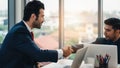 Business background of two businessmen having handshake together after geting business deal in meeting at office Royalty Free Stock Photo