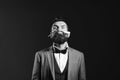 Business and barbershop service concept. Macho in formal suit shaves beard. Businessman with funny grimace Royalty Free Stock Photo