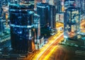 Business bay architecture by night with illuminated buildings, Dubai, United Arab Emirates. Royalty Free Stock Photo