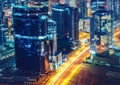 Business bay architecture by night with illuminated buildings, Dubai, United Arab Emirates. Royalty Free Stock Photo