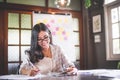 Business beautiful Asian woman working and writing note