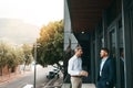 Business becomes a breeze when you work with the right people. two businessmen having a discussion on the office balcony Royalty Free Stock Photo