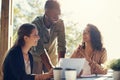 Business is better on a full stomach. a group of creative employees having a breakfast meeting outside. Royalty Free Stock Photo