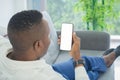 Business black american man, African person using a smartphone or mobile phone with blank screen space on webcam video call Royalty Free Stock Photo